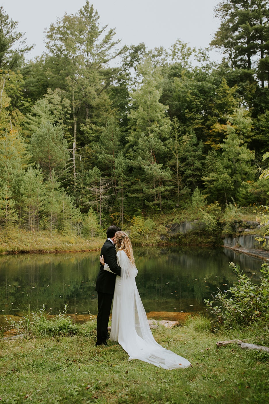 Bride and groom near lake