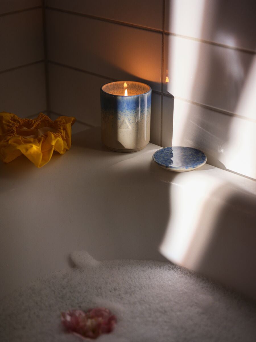 Candle on bathtub