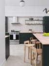 green kitchen with pink counters