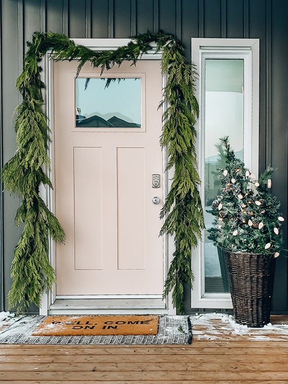 garland wrapped around front door