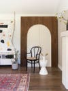 brown cabinet with white arch doors