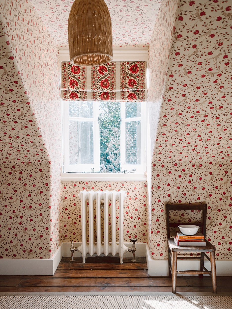 Eaves room with floral wallpaper