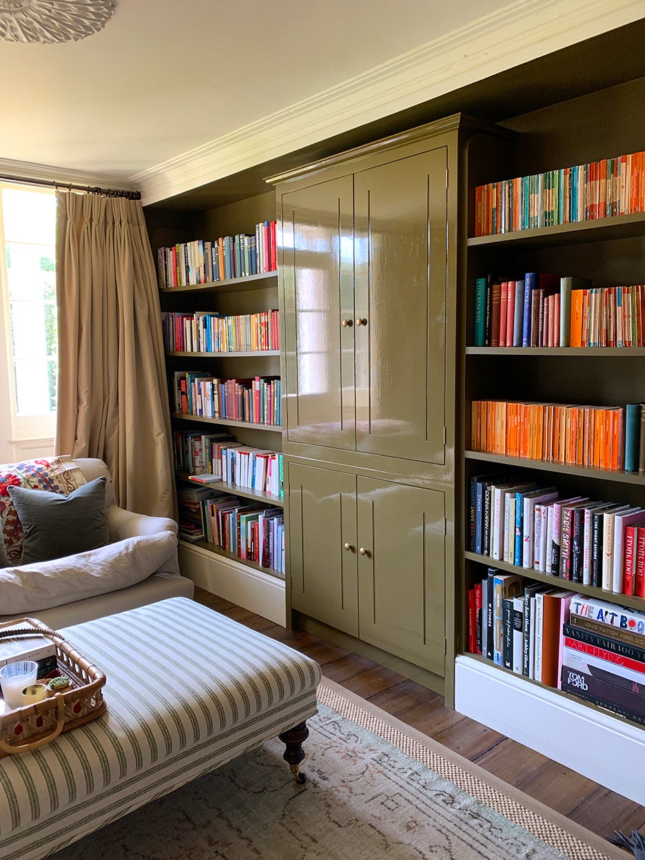 Brown built-in bookcases in library