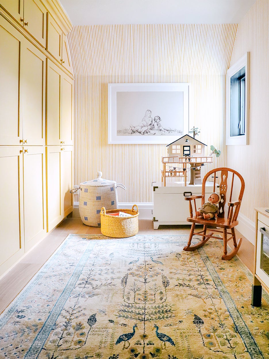 Yellow playroom with striped wallpaper