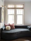 Curved window seat upholstered in charcoal velvet