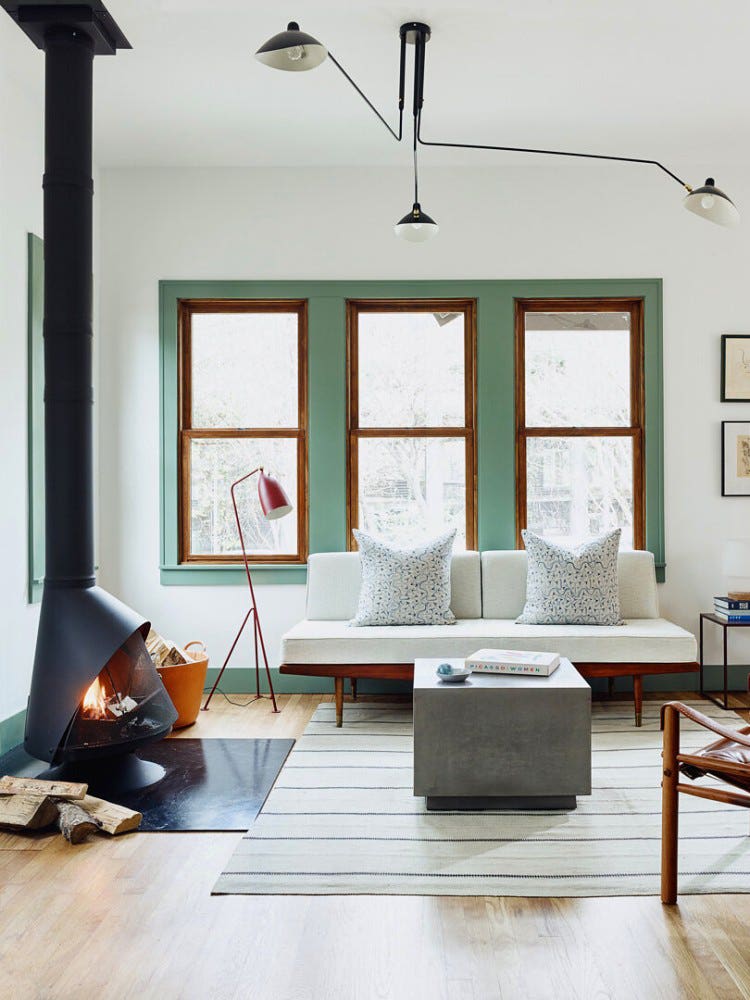 mod livign room with green window trim