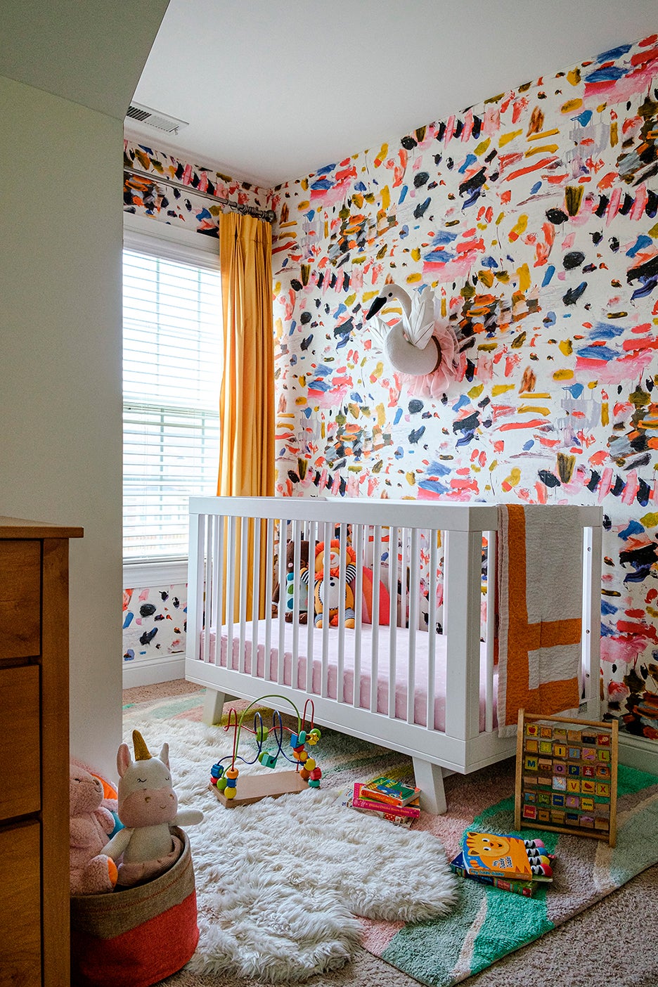 nursery with multicolor paint stroke wallpaper 