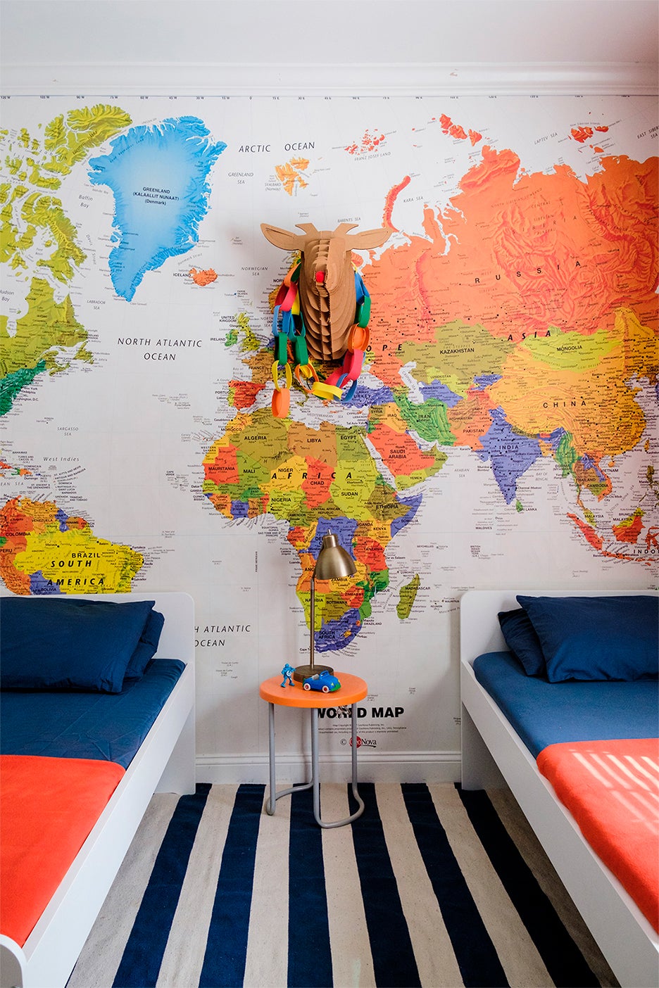 kids' bedroom with world map mural