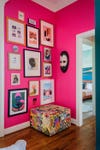 hot pink foyer with gallery wall