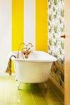 yellow and white striped bathroom