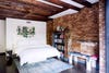 Bedroom with brick walls