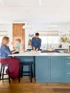 Family in blue-green kitchen