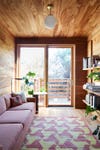 Cozy room with wood paneling on ceiling and walls
