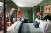 Bedroom with green floral wallpaper