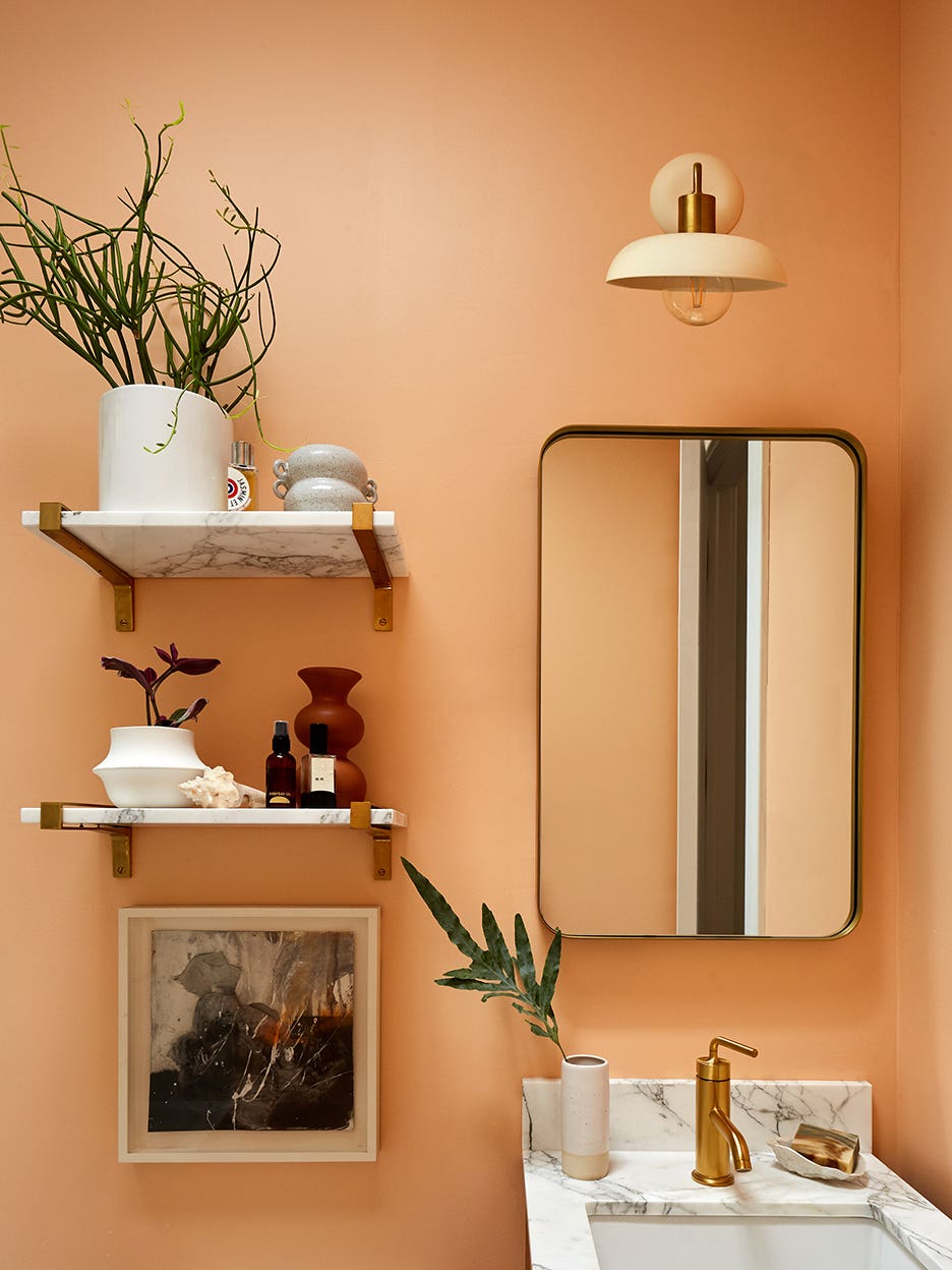 peach bathroom wall with modenr vanity