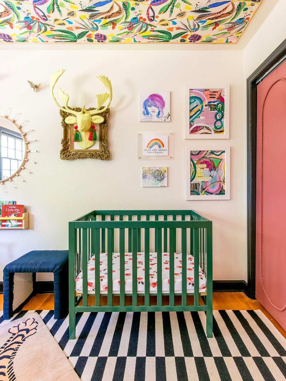 Nursery with green crib and pink closet