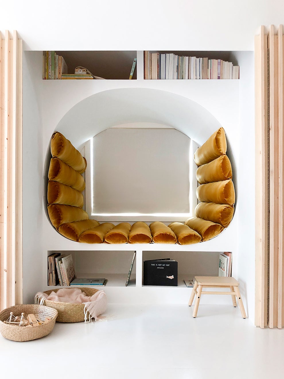 u-shaped reading nook with ochre velvet upholstery
