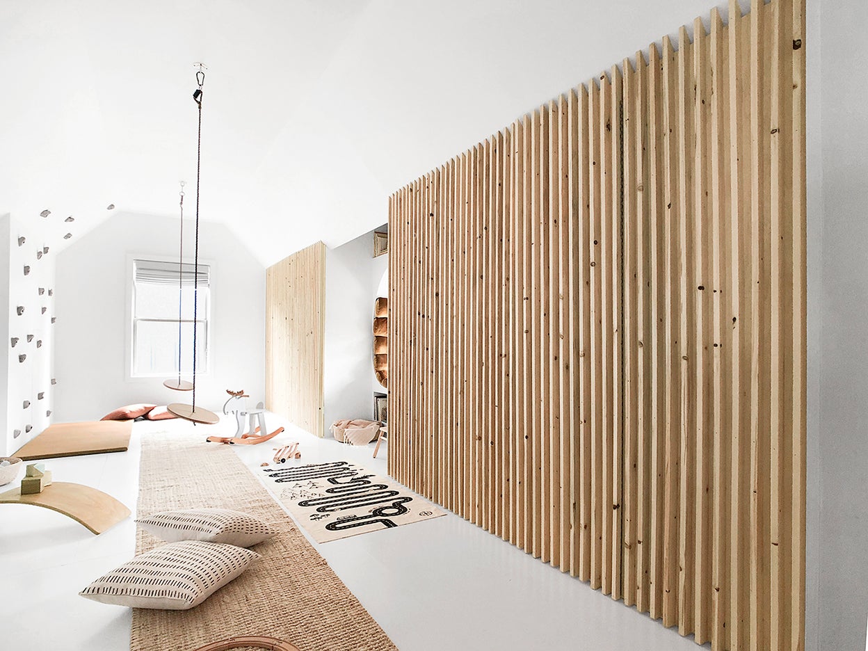 minimalist play space with wood slat walls