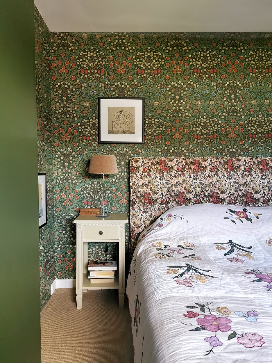Green floral wallpaper in bedroom