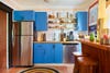 Blue kitchen cabinets with butcher block