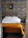 Blue floral wallpaper in bedroom