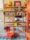 Wood shelving with colorful kids' toys.