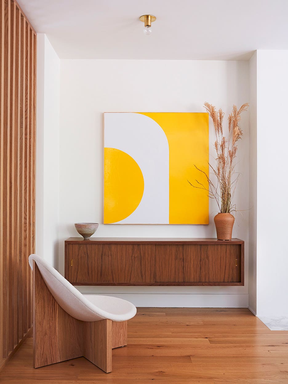 floating credenza with yellow art