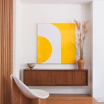 floating credenza with yellow art