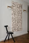 Entryway with tapestry and alabaster wall sconces