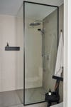 Walk-in shower with striped tile