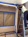 man putting together wood frame