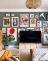 blue iving room with eclectic gallery wall