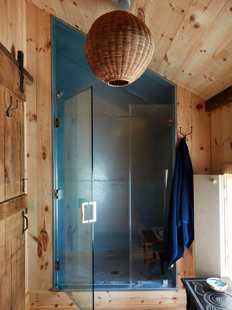 wood bathroom with metal shower