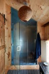 wood bathroom with metal shower