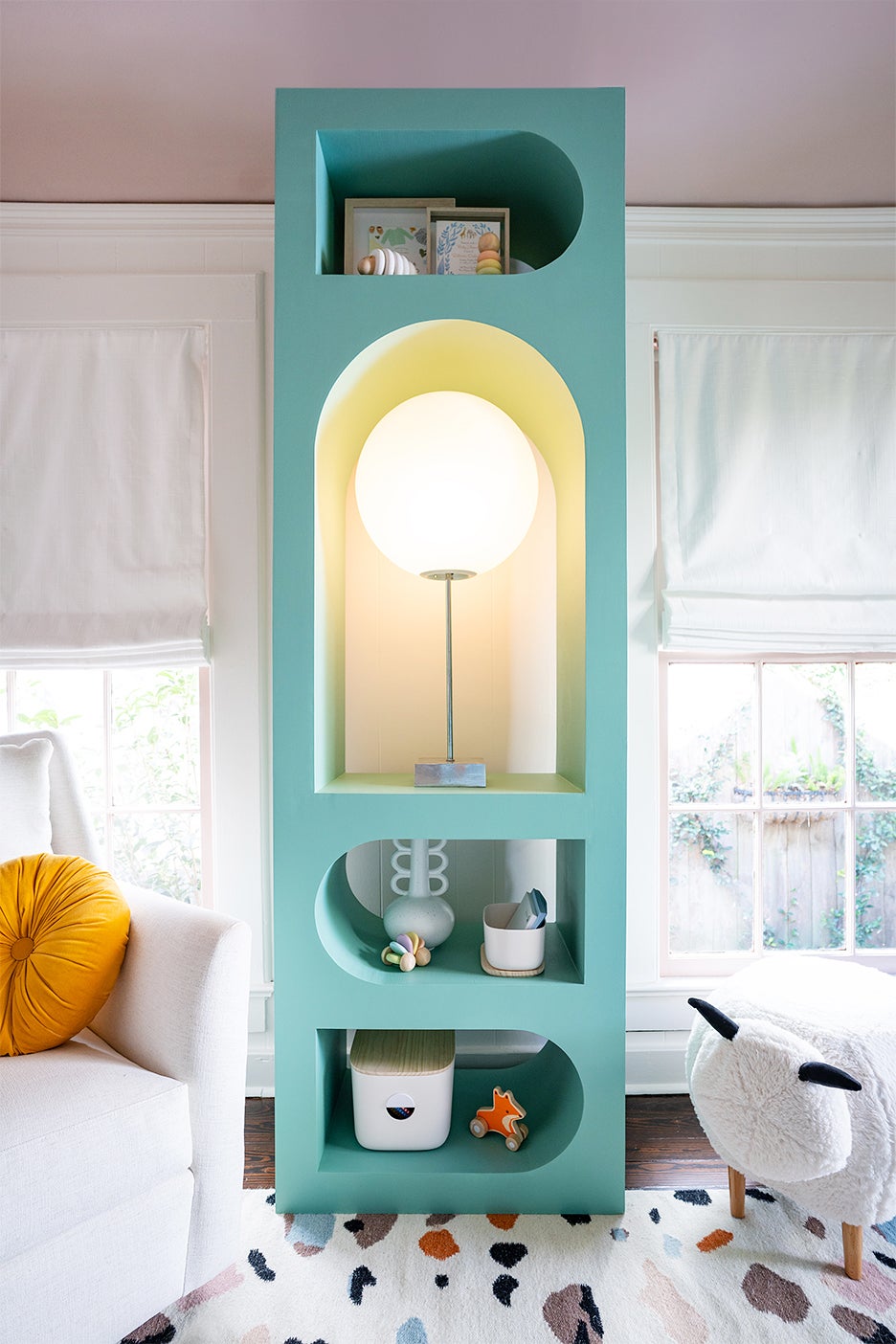 blue bookcase with bright lamp