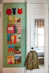 Sage green kids bedrooms - Reading area with books on the wall