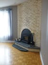 dated brick fireplace and parquet floors