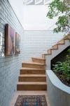 stairwell lined with white bricks
