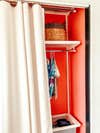 red closet with fabric panel