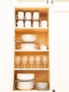 white plates stacked in cabinet