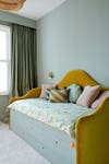 curved yellow velvet bedroom