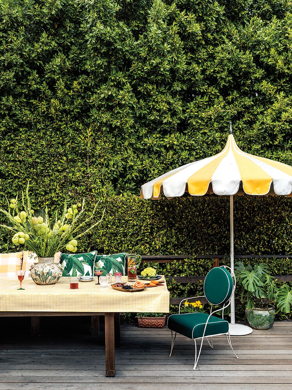 ivy covered wall with dining table