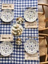 Gingham tablecloth with bowls of eggs on the table