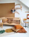 Terracotta rooms - wood crib with color blocked brown paint