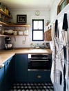 IKEA kitchen cabinets - small kitchen with window and blue cabinets 