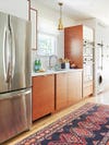 IKEA kitchen cabinets - fridge and wood cabinetry