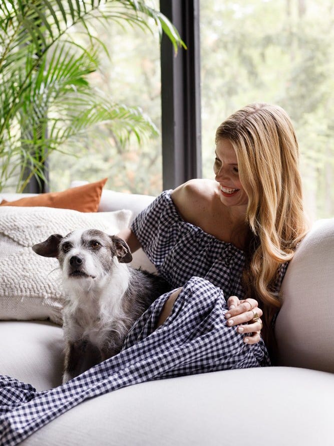 woman with dog on couch
