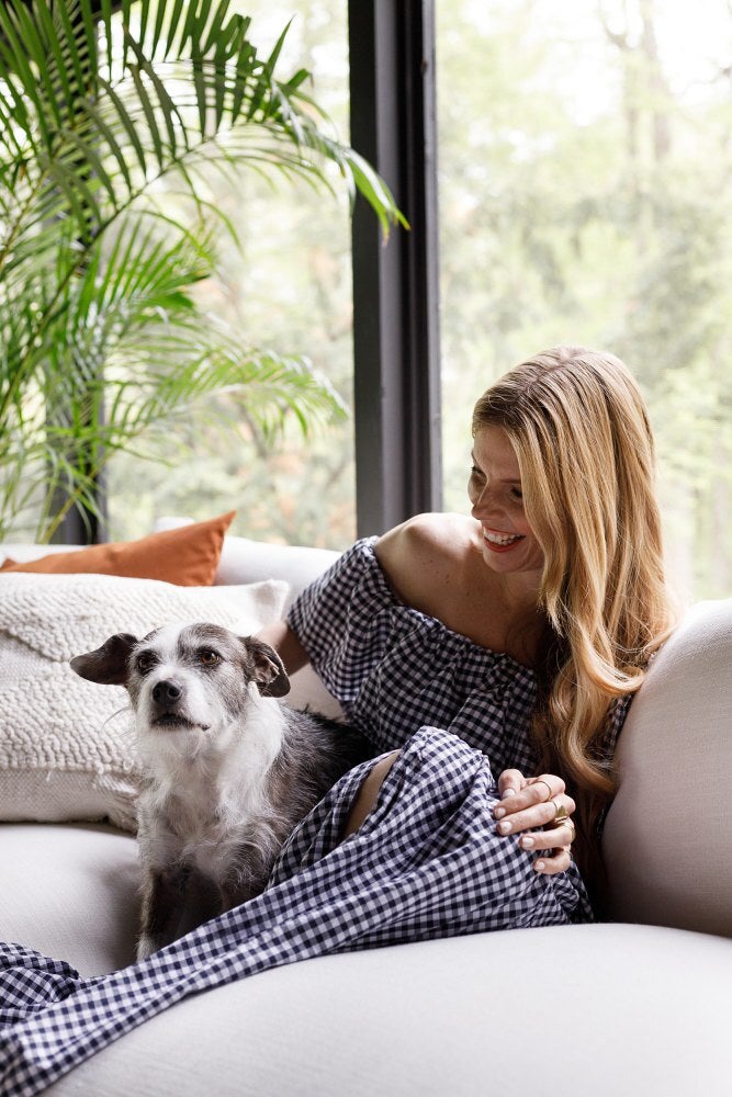 woman with dog on couch