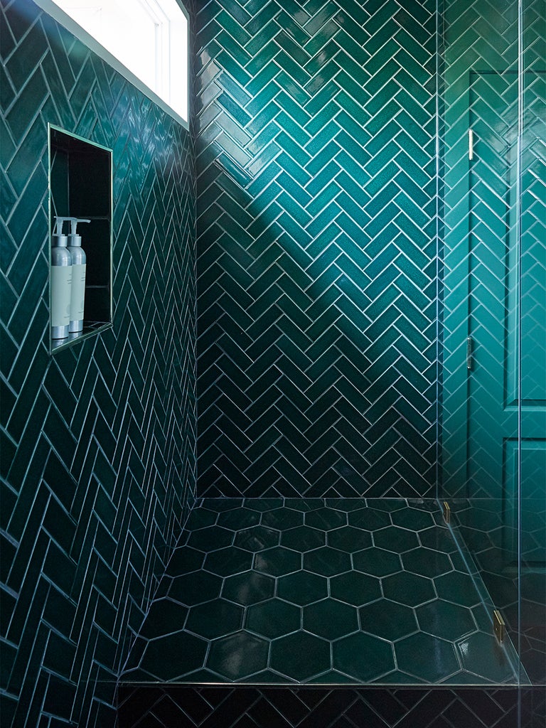 a green tiled shower