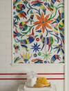 Bathroom wall featuring tiled mosaic in Otomi pattern with animals and plants.
